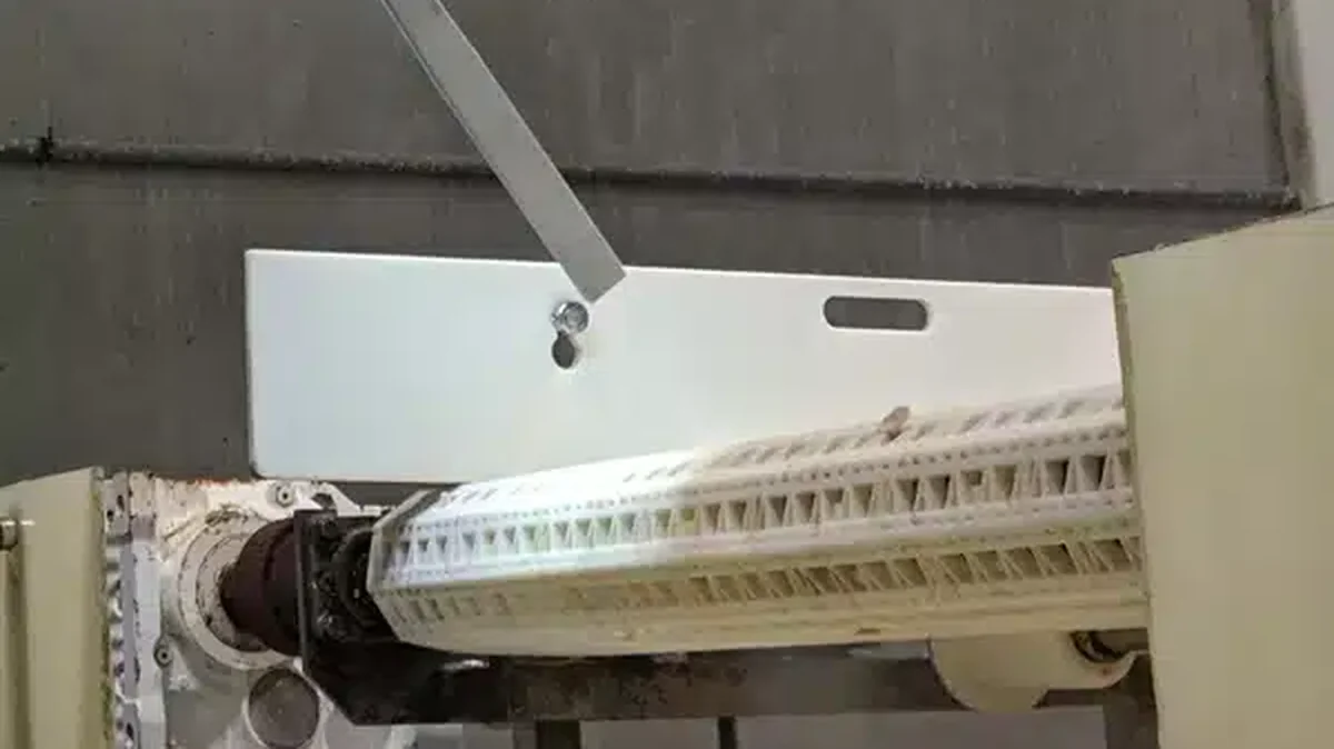 Cold Jet dry ice blasting cleans a conveyor in meat processing